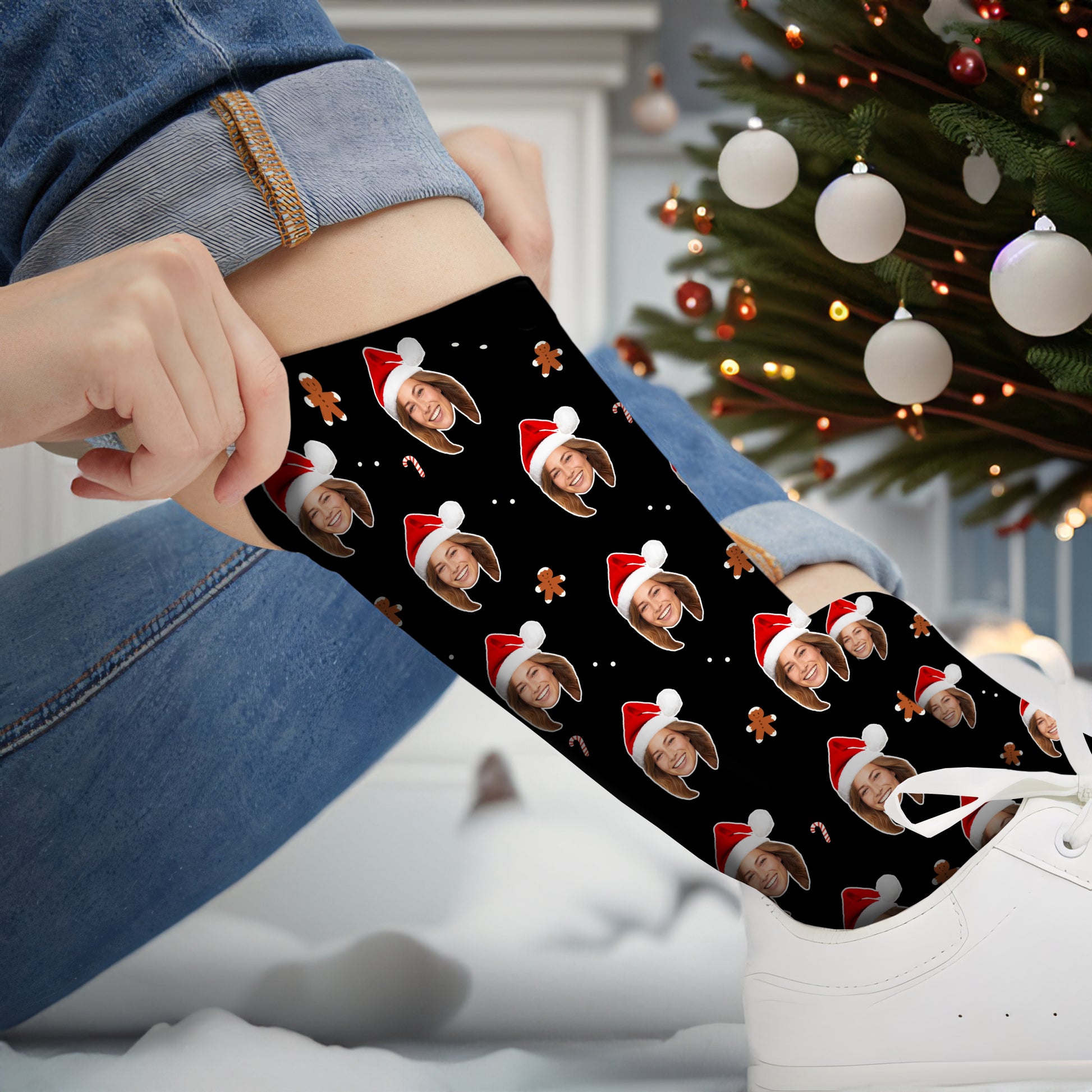 Unique Christmas gift socks with a custom face wearing a Santa hat, designed with festive icons like candy canes and gingerbread men. The socks are ideal for adding a personal touch to holiday outfits.